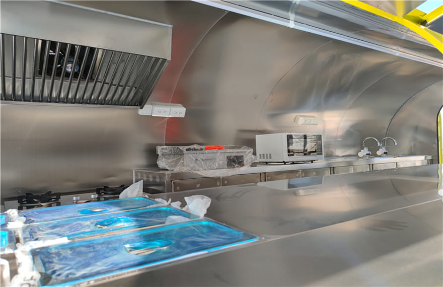 cooking equipment in the yellow pizza concession trailer